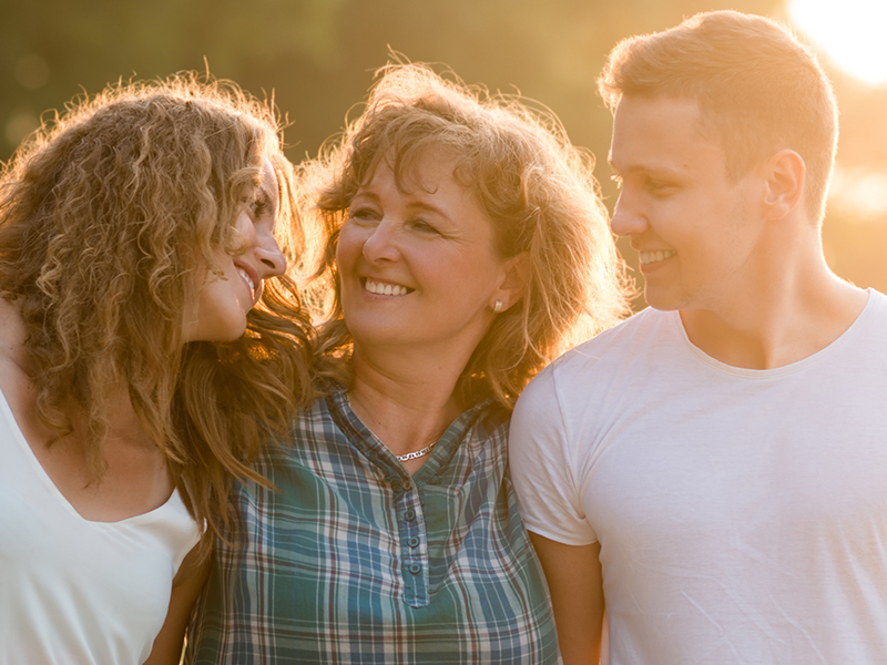 Caucasian family outdoors, spending quality time together.